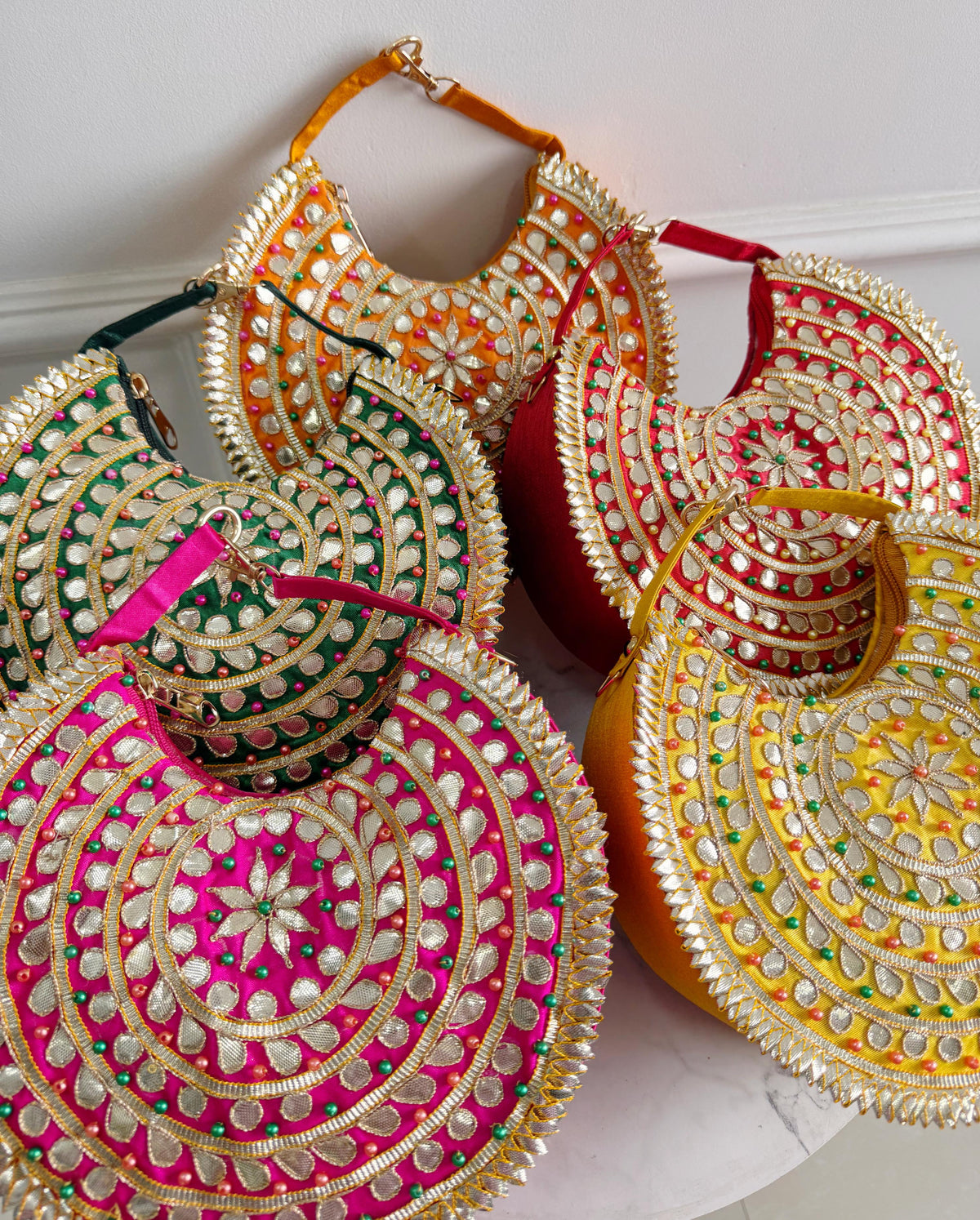 Param Sundari -The Gota Patti Crescent Bag orange