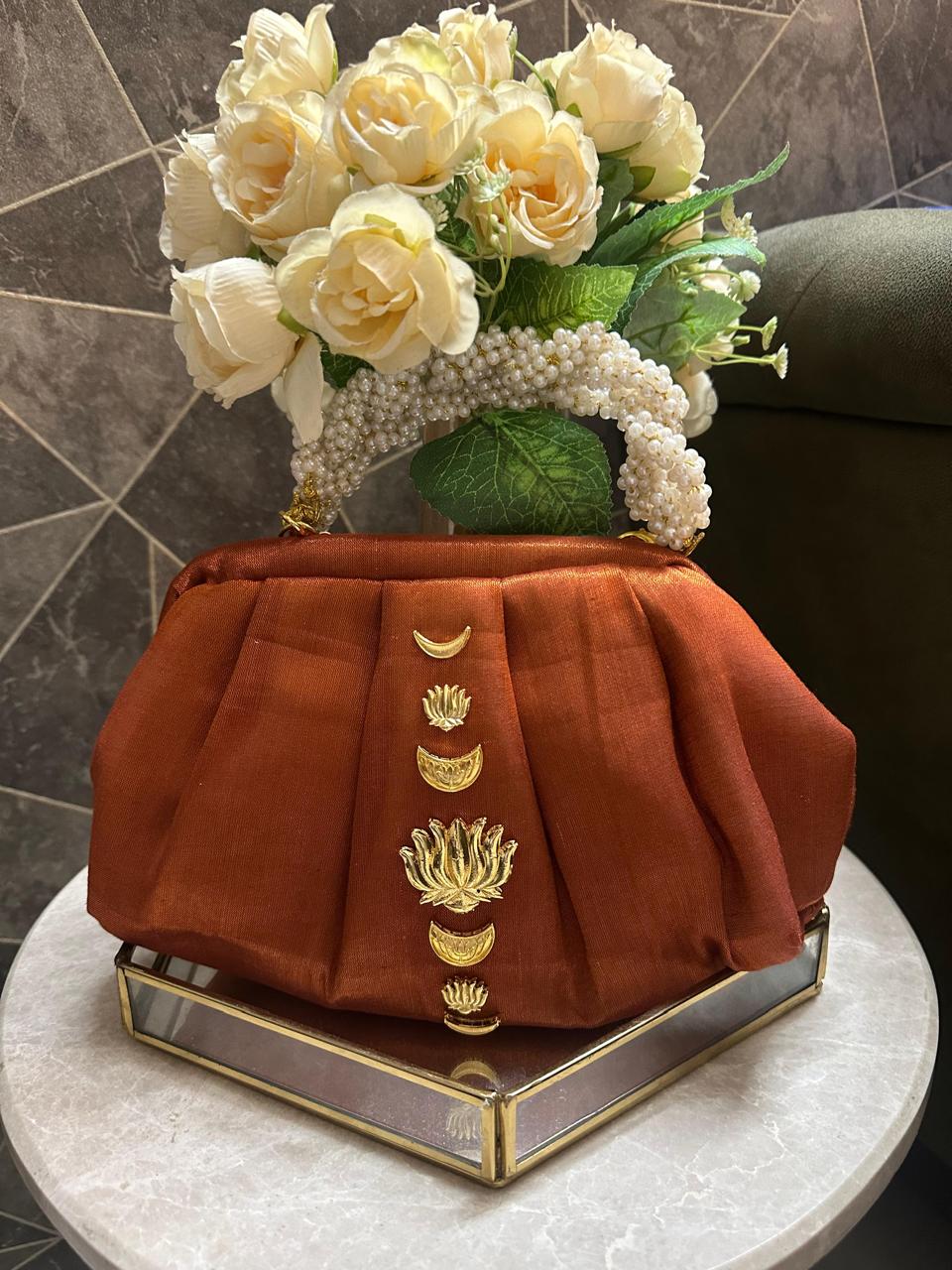 “Divine Lotus Glow Potli – Rust Orange” The Heere Zewar Edit