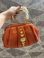 “Divine Lotus Glow Potli – Rust Orange” The Heere Zewar Edit