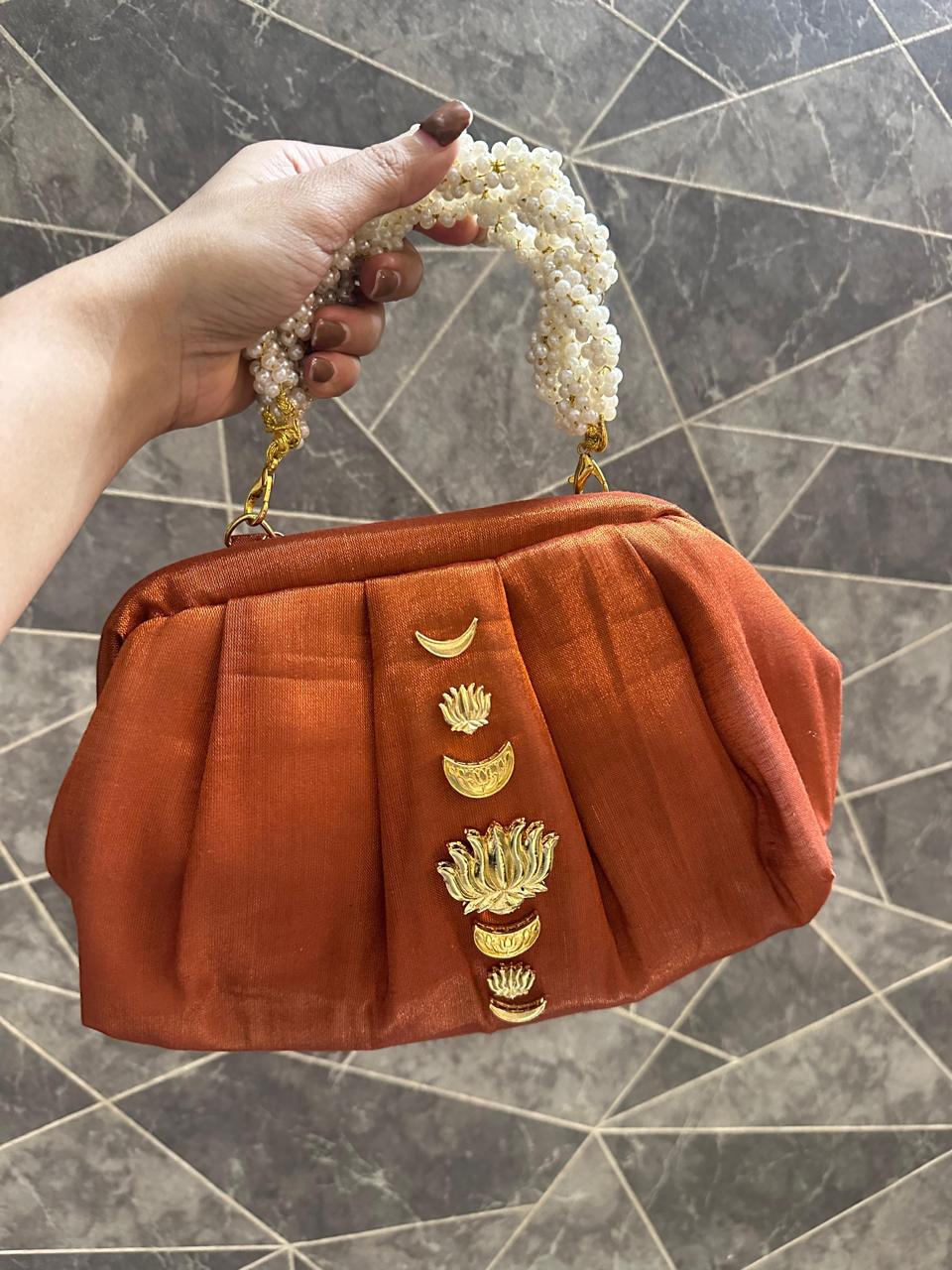 “Divine Lotus Glow Potli – Rust Orange” The Heere Zewar Edit